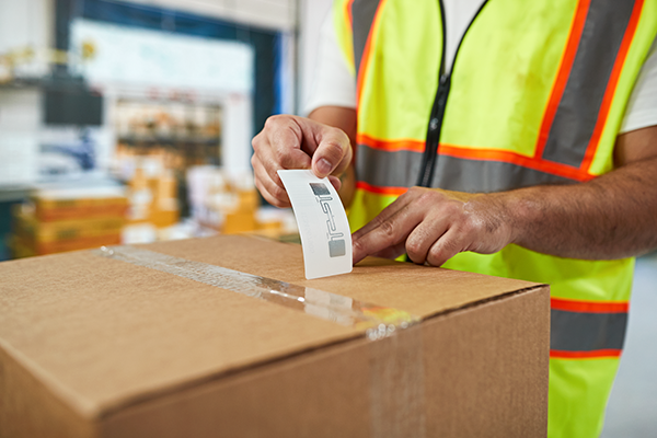 RFID label being applied to a box