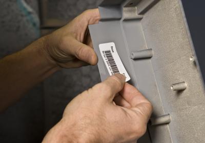 Label Being Placed on Equipment