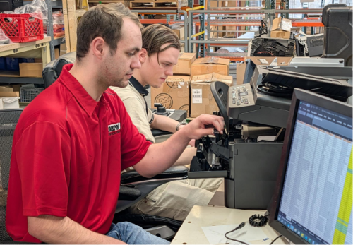 Service Technician Working on Printer
